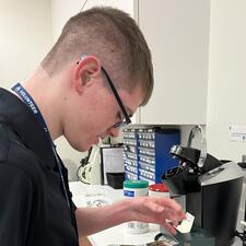 Student looking at stamps