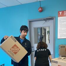 Student moving boxes